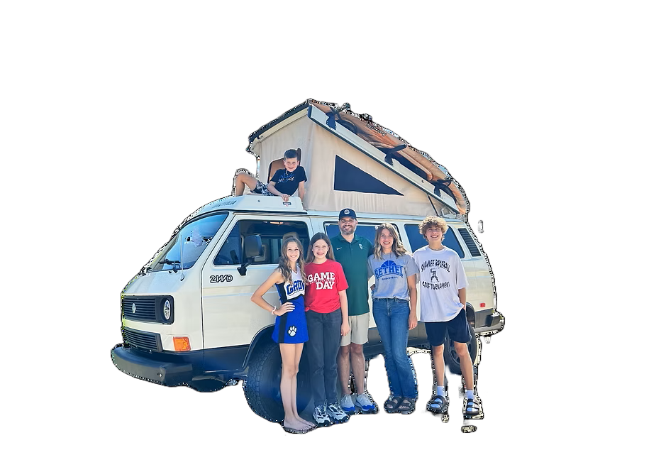 Ryan Busler with his family and Volkswagen camper van
